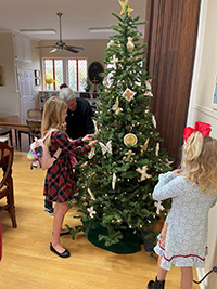 Image of the Chrismon tree as it is being decorated